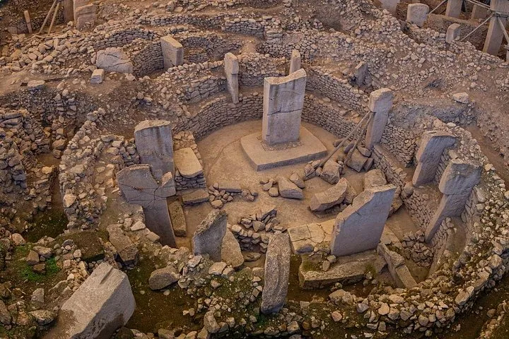 Aerial view of the round stone enclosures and T-shaped pillars on a Gobekli Tepe tour from Istanbul by plane, Turkey
