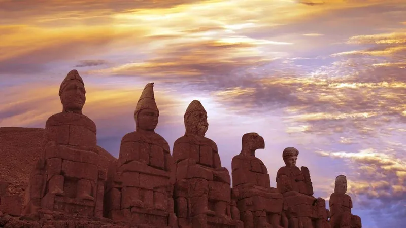 The stone god statues of Mount Nemrut against an evening sky on a Gobekli Tepe tour of two days from Istanbul, Turkey