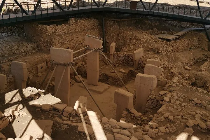 T-shaped pillars in an enclosure in late light on a Gobekli Tepe tour of two days with flights from Istanbul, Turkey