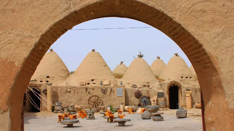 The beehive houses of Harran seen through a mud-brick arch on a Gobekli Tepe tour with return flights from Istanbul, Turkey