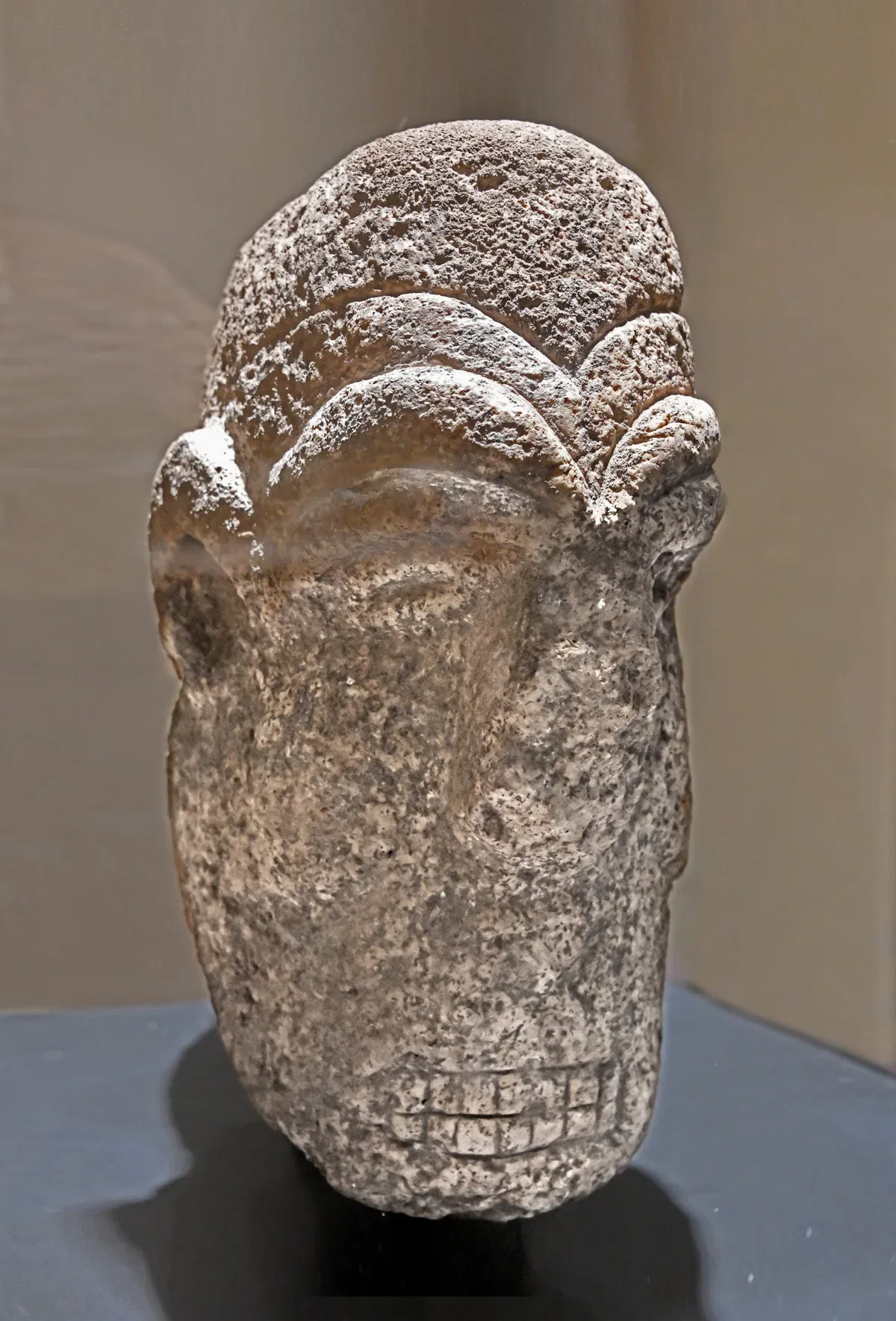 A carved stone human head from Karahan Tepe shown in the Şanlıurfa museum on Göbekli Tepe tours