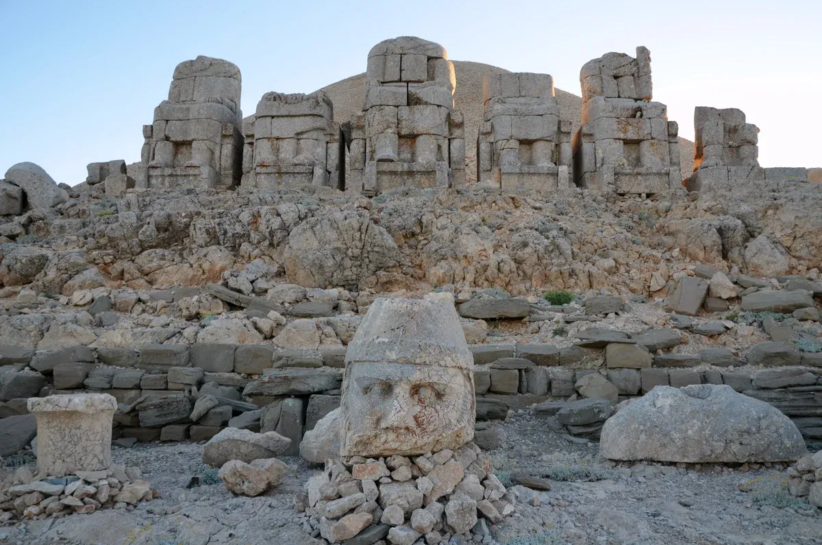 Stone heads of gods in front of the thrones on the east terrace of Mount Nemrut, added on two-day and three-day Gobekli Tepe tours